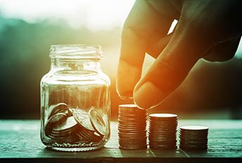 Person counting coins