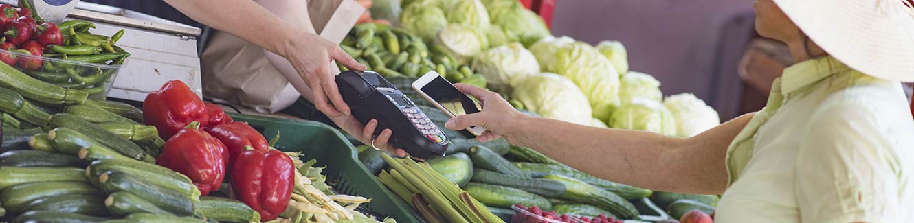 Small produce business with a card reader for transactions.